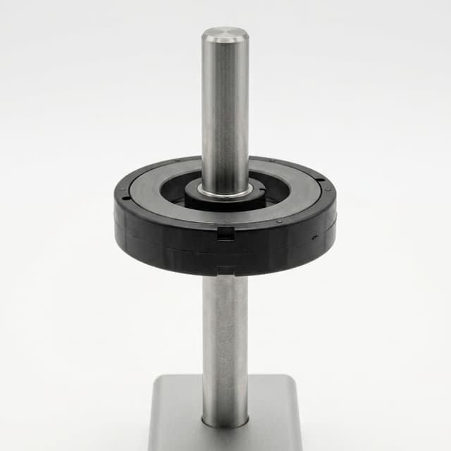 Insert molding magnet on steel shaft